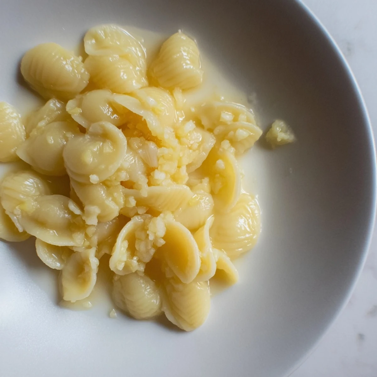 A steaming bowl of creamy 3-Ingredient Butter & Garlic Ditalini, ready to enjoy with family.