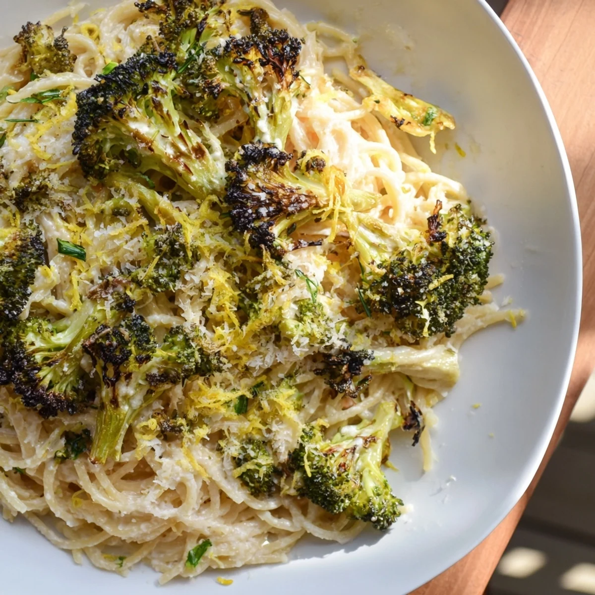 Golden roasted garlic and lemon-infused Roasted Garlic Lemon Broccoli Angel Hair Pasta, ready to serve and enjoy.