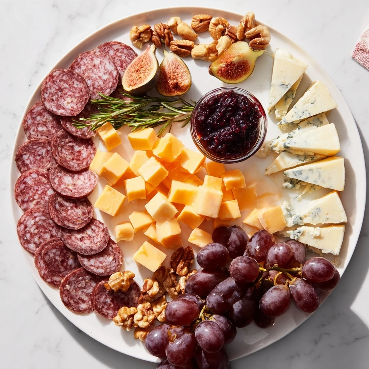 This elegant Deer Antler Charcuterie boasts colorful salami, gouda, and grapes, arranged invitingly for a savory appetizer.