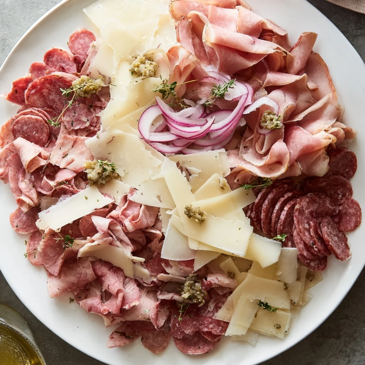 A gourmet charcuterie board showcasing beautifully arranged The Burlap & Lace meats and cheeses, ready to enjoy.