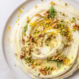 This vibrant Butter Board Charcuterie features creamy butter topped with nuts, herbs, and lemon, ready to be enjoyed.