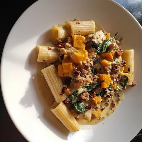 Creamy Rigatoni with Butternut Squash, a hearty pasta dish with visible sausage and creamy sauce.