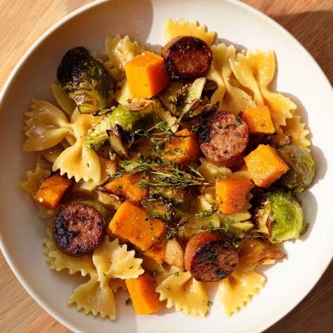 One-pan autumn sausage pasta squash with browned sausage, tender squash, and crispy Brussels sprouts.