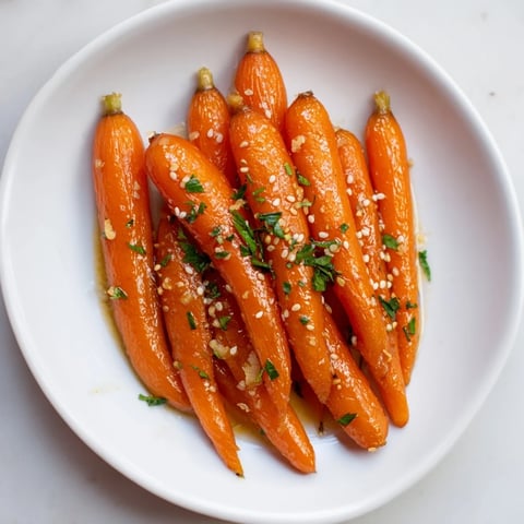 Golden, caramelized Honey Soy Roasted Carrots offer a sweet and savory, visually appealing side dish.