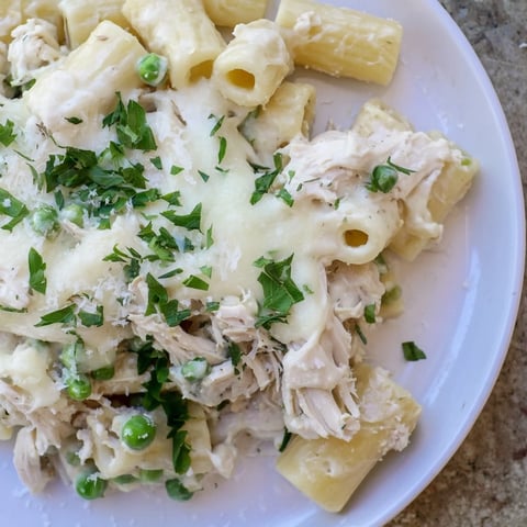 Slow cooker chicken Alfredo pasta bake, perfect for a cozy dinner, is creamy and bubbling hot.