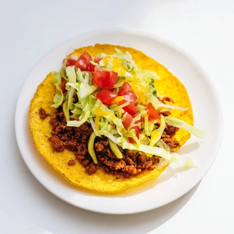 Crispy flour tortillas filled with meaty cheeseburger goodness, a delicious image of the Viral Cheeseburger Tacos.