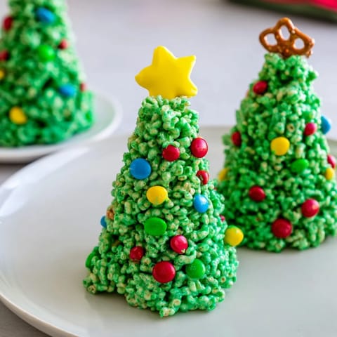 These homemade Christmas Tree Rice Crispy Treats are festively shaped; sweet, crunchy, and ready to enjoy now!