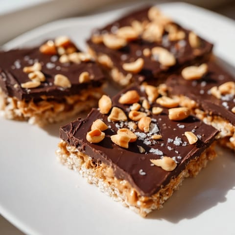 Deliciously decadent Peanut Butter Chocolate Rice Cakes, crunchy rice cakes topped with melting chocolate and peanuts.