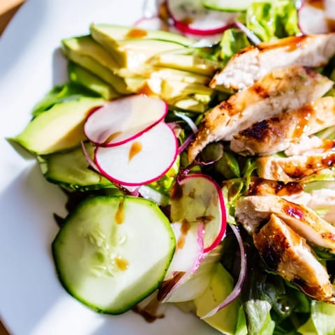This Spring Detox Chicken Salad showcases juicy chicken, crisp veggies, and a drizzle of zesty lemon vinaigrette for a light, healthy meal.