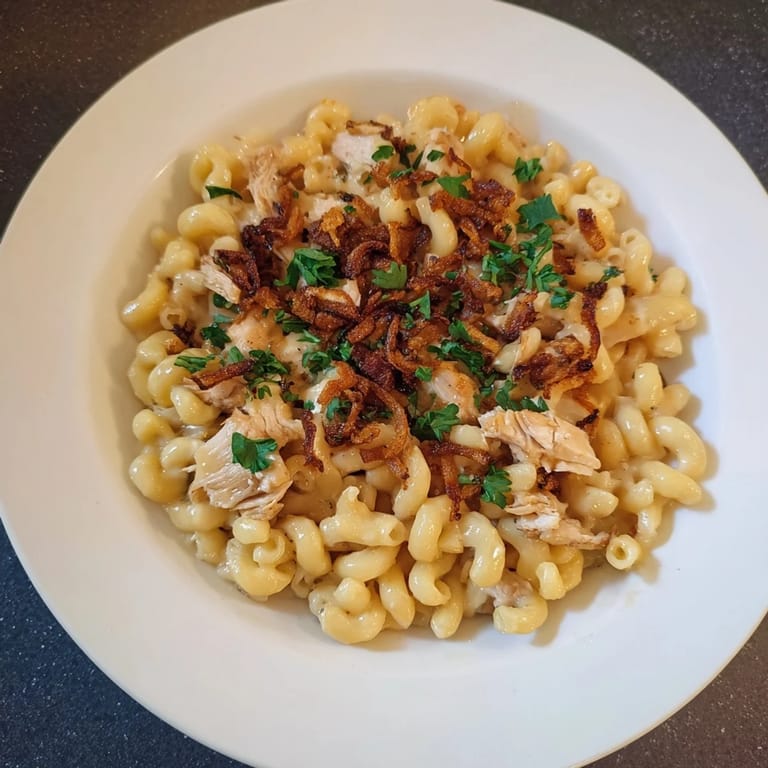 Golden, cheesy One-Pot Honey BBQ Chicken Mac and Cheese with a sweet, smoky BBQ aroma.