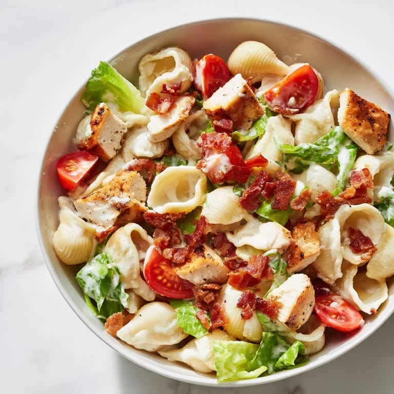Fresh BLT Chicken Pasta Salad tossed with smoky bacon, grilled chicken, and veggies, perfect for a summer lunch or potluck.