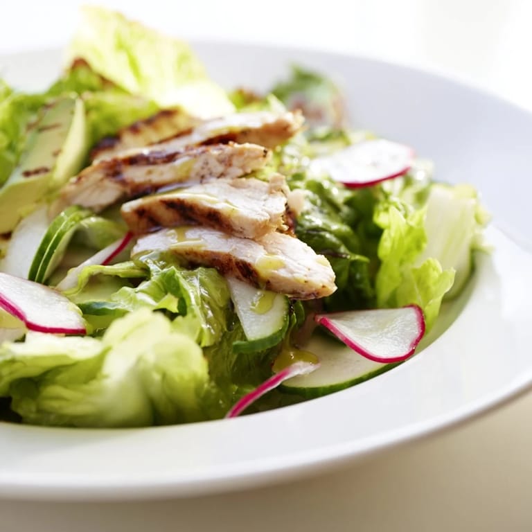 Bright, spring greens and tender chicken mingle with sliced cucumber and radish in a bowl of refreshing Spring Detox Chicken Salad.