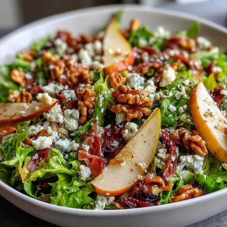 Freshly sliced pears and creamy blue cheese make this Frisée Pear Blue Cheese Bowl a perfect fall salad.